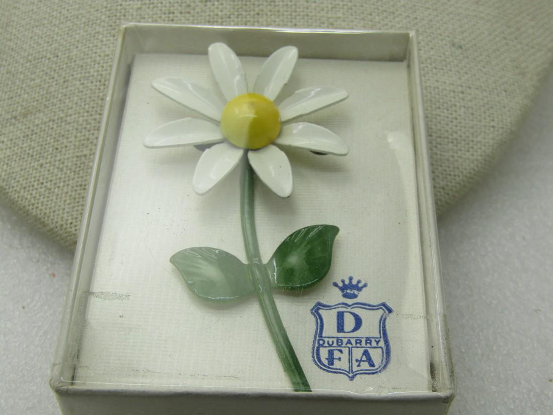 Vintage Dubarry White Daisy Brooch, In Original Box,: Vintage Dubarry White Daisy Brooch, In Original Box, 1960's, 3" by 1.5". Signed D Dubarry F/A inside blue shield with crame on card inside on the mounting card. Very good condition. Enameled in white,