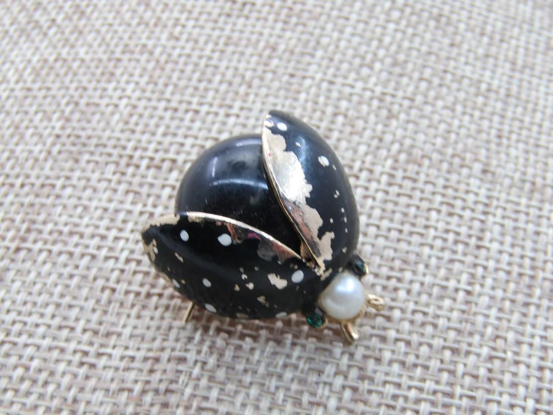 Vintage Enameled Beetle Brooch, Faux Pearl, Mid-Century: Vintage Enameled Beetle Brooch, Faux Pearl, Mid-Century 1" black round acrylic body with black enameled wings with white dots and gold antenna and a faux pearl head. There is some black enameling worn