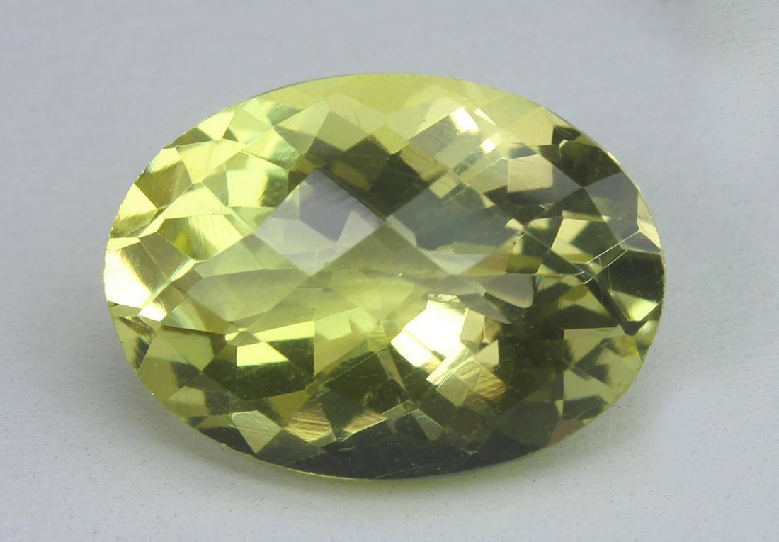 11.63 Ct Natural Lemon Quartz: No Reserve! Title: 11.63 Ct Natural Lemon Quartz Additional Information: Gemstone : Lemon QuartzWeight : 11.63 CtsShape : Oval CutColour : Greenish YellowDimensions : 17.9x13x9.7 mmOrigin : Brazil Tra