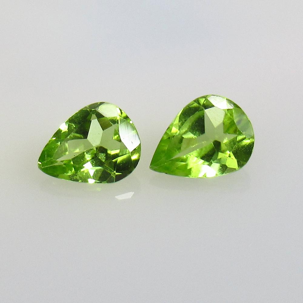1.87 Ct Natural Pakistan Peridot Pear Pair: No Reserve! Title: 1.87 Ct Natural Pakistan Peridot Pear Pair Stone Clarity: VVS Gemstone: Natural Peridot Carat Weight: 1.87 Size/Dimensions: 8.00 x 6.00 x 3.40 mm / 2 PC's Additional Information: To