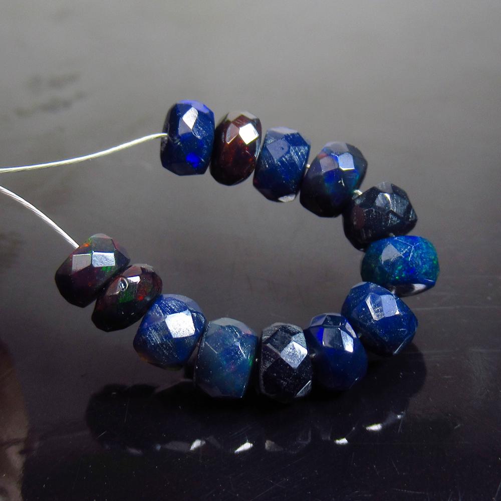 4.67 Ct Natural 13 Drilled Faceted Black Fire Opal: No Reserve! Title: 4.67 Ct Natural 13 Drilled Faceted Black Fire Opal Beads Stone Clarity: Translucent Gemstone: Natural Black Opal Beads Carat Weight: 4.67 Size/Dimensions: 4.30 to 5.00 mm / 13 PC's 