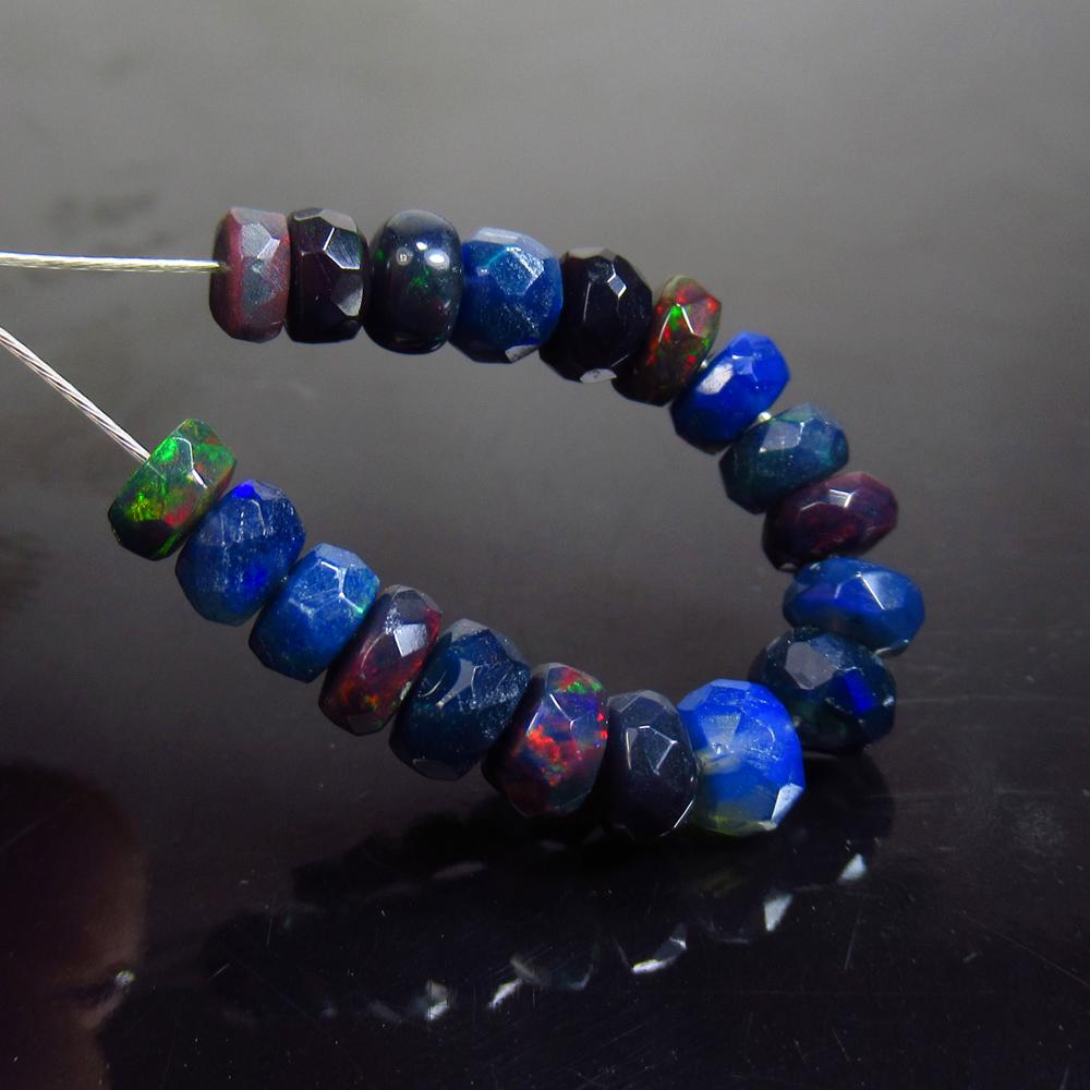 4.10 Ct Natural 19 Drilled Faceted Black Fire Opal: No Reserve! Title: 4.10 Ct Natural 19 Drilled Faceted Black Fire Opal Beads Stone Clarity: Translucent Gemstone: Natural Black Opal Beads Carat Weight: 4.10 Size/Dimensions: 3.80 to 4.50 mm / 19 PC's 