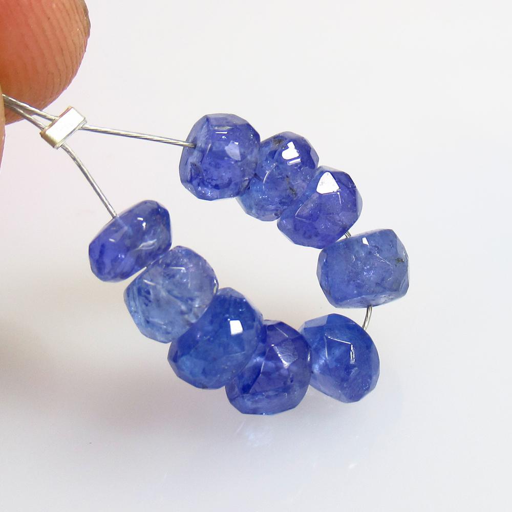 9.80 Ct Natural 9 Drilled Tanzanite Round Beads: No Reserve! Title: 9.80 Ct Natural 9 Drilled Tanzanite Round Beads Stone Clarity: Transparent Gemstone: Natural Tanzanite Beads Carat Weight: 9.80 Size/Dimensions: 5.30 to 5.70 mm / 9 PC's Additional 