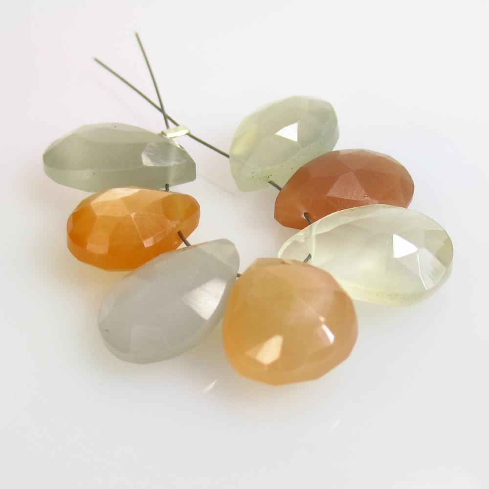 24.57 Ct Natural 7 Drilled Moonstone Pear Beads: No Reserve! Title: 24.57 Ct Natural 7 Drilled Moonstone Pear Beads Stone Clarity: Opaque Gemstone: Natural Moonstone Beads Carat Weight: 24.57 Size/Dimensions: 11.2x9.0 to 14.0x9.3 mm / 7 PC's Additio