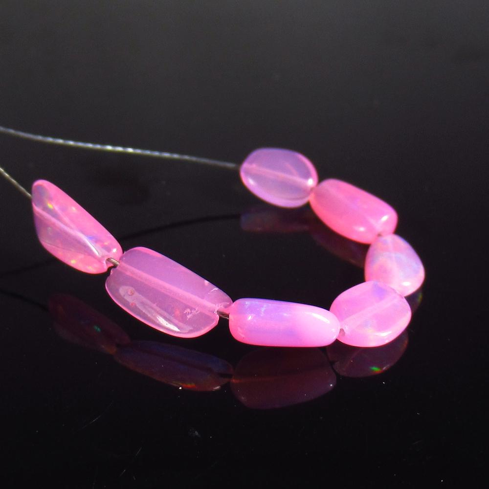1.82 Ct Natural 7 Drilled Pink Fire Opal Beads: No Reserve! Title: 1.82 Ct Natural 7 Drilled Pink Fire Opal Beads Stone Clarity: Transparent Gemstone: Natural Pink Opal Beads Carat Weight: 1.82 Size/Dimensions: 5.3x4.2 to 7.9x4.3 mm / 7 PC's Additi
