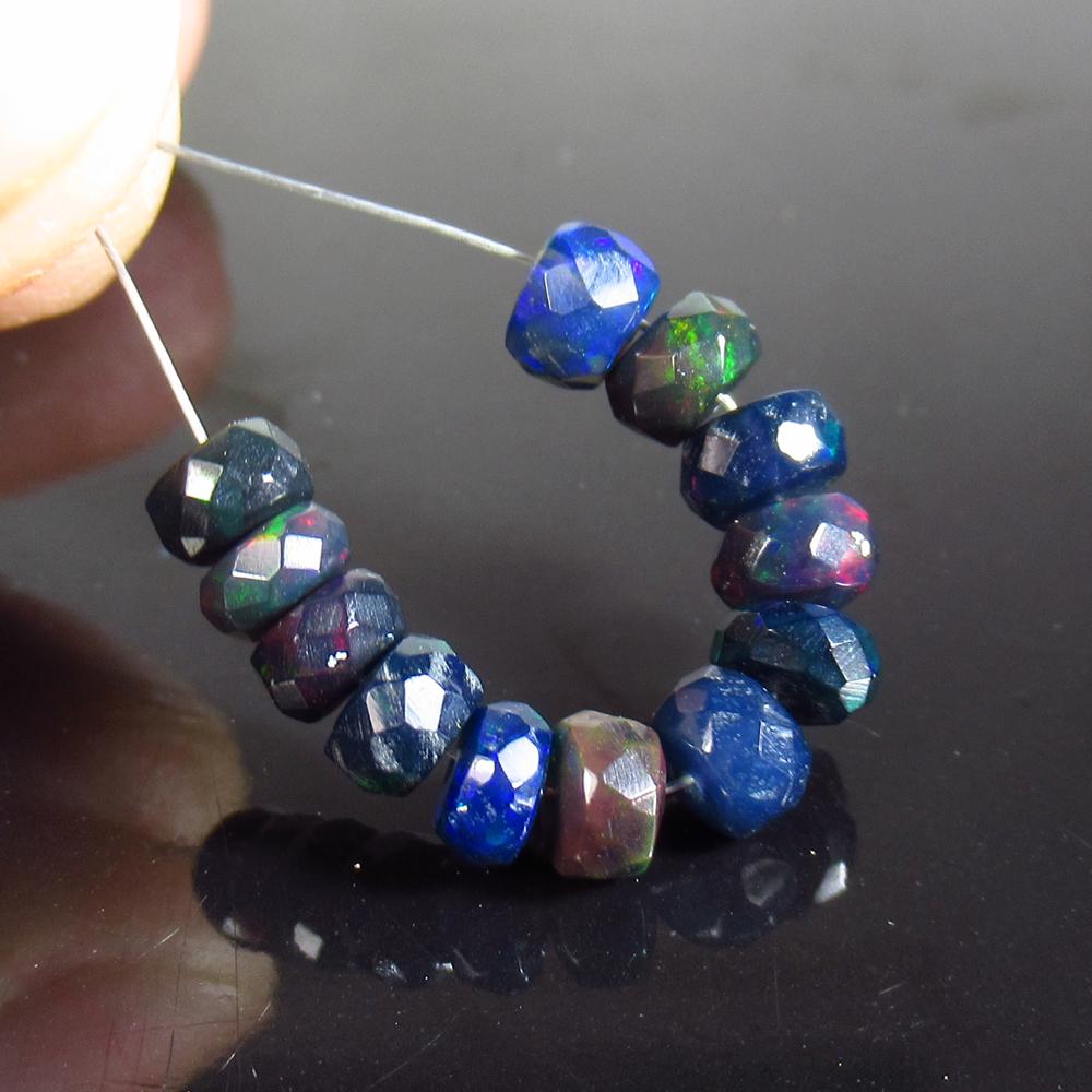 3.45 Ct Natural 12 Drilled Faceted Black Opal Beads: No Reserve! Title: 3.45 Ct Natural 12 Drilled Faceted Black Opal Beads Stone Clarity: Translucent Gemstone: Natural Faceted Black Opal Beads Carat Weight: 3.45 Size/Dimensions: 4.50 to 4.80 mm / 12 PC