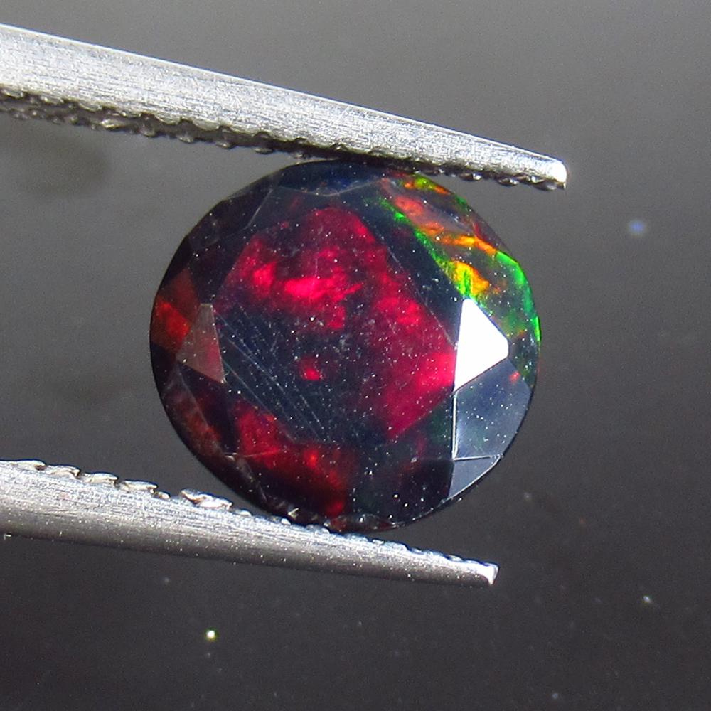 1.73 Ct Natural Ethiopian Black Fire Opal Round Cut: No Reserve! Title: 1.73 Ct Natural Ethiopian Black Fire Opal Round Cut Stone Clarity: Translucent Gemstone: Natural Black Opal Carat Weight: 1.73 Size/Dimensions: 8.50 x 8.50 x 5.00 mm Additional Info