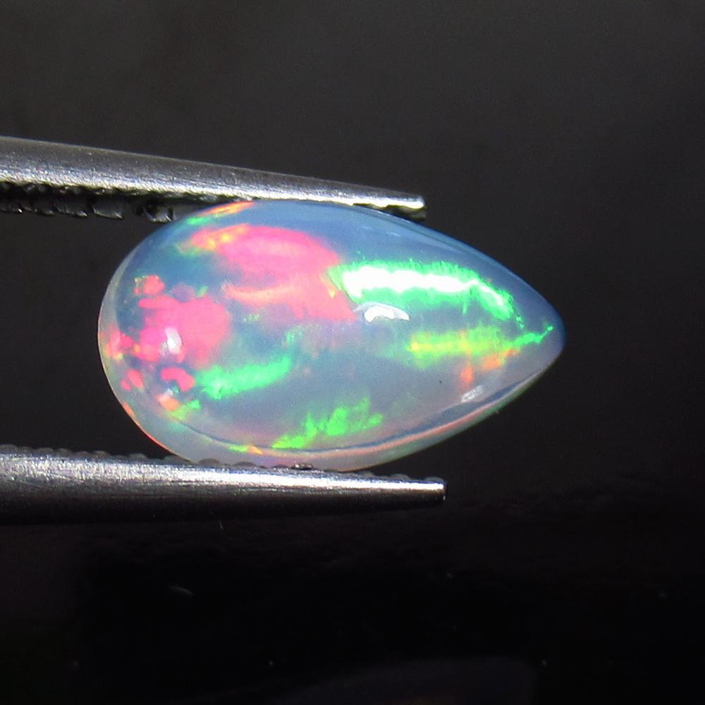 1.41 Ct Natural Ethiopian Multicolor Opal Pear Cab: No Reserve! Title: 1.41 Ct Natural Ethiopian Multicolor Opal Pear Cab Stone Clarity: Transparent Gemstone: Natural Opal Carat Weight: 1.41 Size/Dimensions: 12.0 x 6.80 x 4.00 mm Additional Information