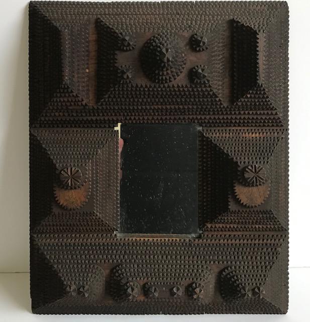 Tramp Art Frame: Title: Tramp Art Frame Provenance/Additional Info: Finely notched folk art frame with 12 layers and 8 layers from the late 19th century. Measures 14” by 16” with opening approximately 4”