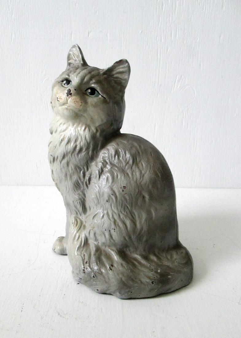 HUBLEY PERSIAN CAT DOORSTOP: Title: HUBLEY PERSIAN CAT DOORSTOP Date: C 1920’s Material: Cast Iron Dimensions: 9”H X 6 3/8”W X 4 3/4”D Provenance/Additional Info:Full bodied hollow two piece casting, marked &#