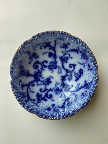 Flow Blue Bowl: Title: Flow Blue Bowl Dimension: 9 ¼” Provenance/additional info: An English bowl decorated with a flow blue pattern. Shipping: Domestic: Flat-rate of $15.00 to anywhere within the contiguou