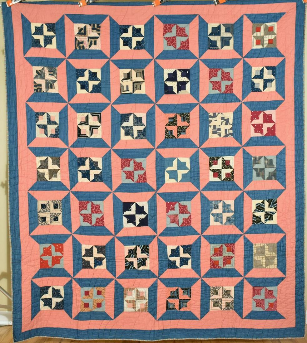1890's "The Bat" Quilt, with Rare Pattern: This cotton 1880's/1890's quilt is hand pieced and hand quilted, with an unusual, graphic design known simply as "the bat" surrounded by a three-dimensional cadet blue and cinnamon pink frame. It meas