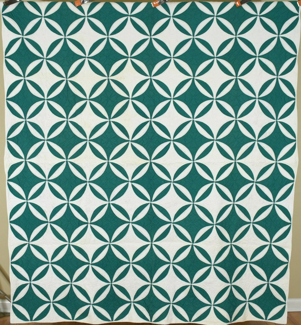 30's Green Rob Peter to Pay Paul Quilt: This cotton 30's deep kelly green and white rob Peter to pay Paul/melon patch quilt is hand pieced and hand quilted, with a wonderful Escher-like reverse pattern. It measures 80 X 84" and is in excell