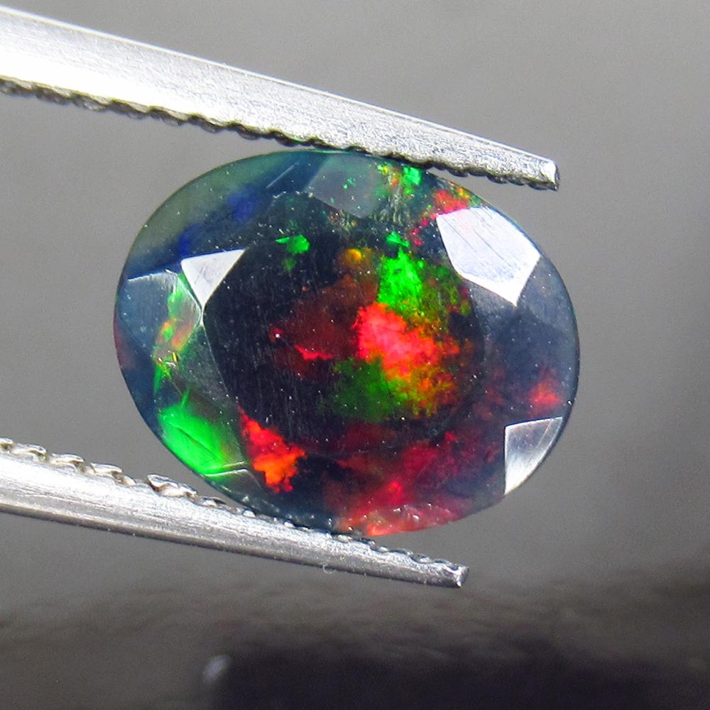 1.44 Ctw Natural Ethiopian Black Fire Opal Oval Cab: Title: 1.44 Ctw Natural Ethiopian Black Fire Opal Oval Cab Stone Clarity: Translucent Gemstones: Black Opal Size/Dimensions: 1.44 Carat Weights: 9.90 x 7.90 x 4.80 mm Additional Information: Excellent