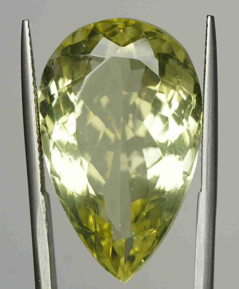 Huge Natural yellow Citrine 26.02: Title: Huge Natural yellow Citrine 26.02 Shape: Pear. MIXED CUT Color: Intense Lemon Yellow Gemstone Type: Natural yellow Citrine Carat Weights: 26.02 carat Transparency: Transparent Origin: Madagasca
