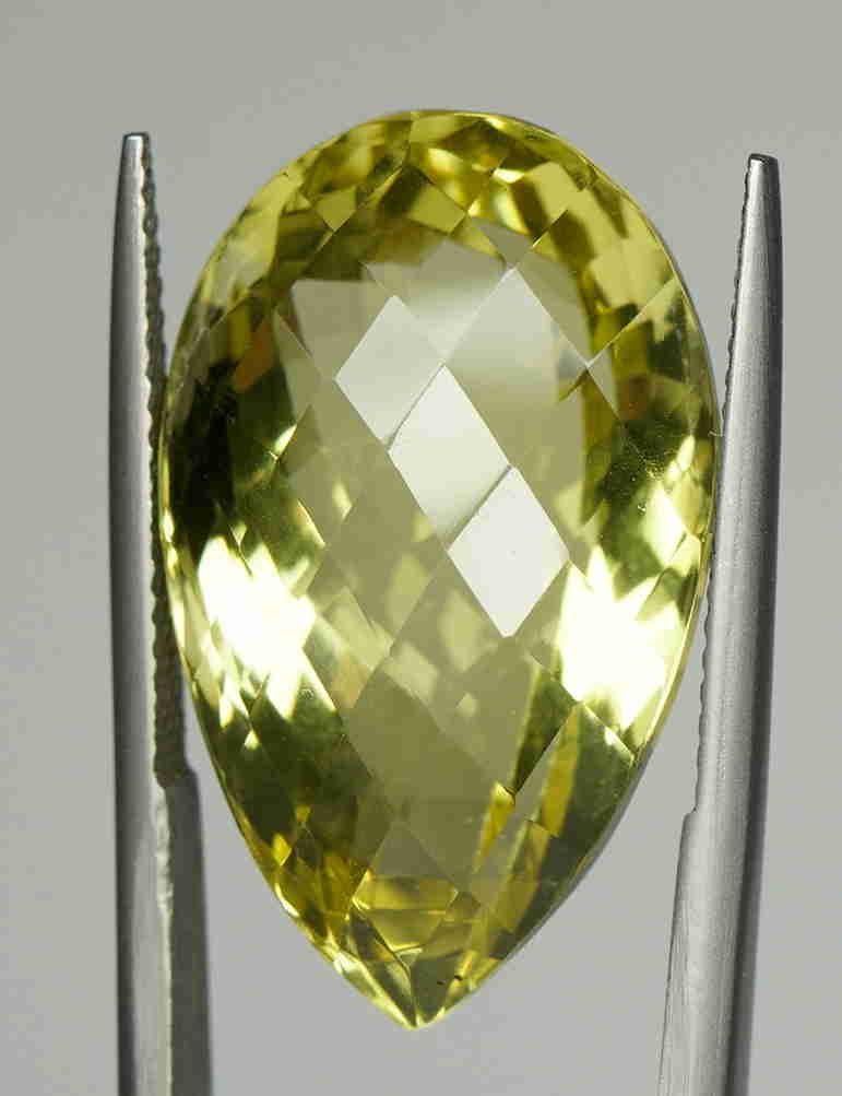 Huge Natural yellow Citrine: Title: Huge Natural yellow Citrine Shape: Pear. MIXED CUT Color: Intense Lemon Yellow Gemstone Type: Natural yellow Citrine Carat Weights: 26.56 carat Transparency: Transparent Origin: Madagascar Addi
