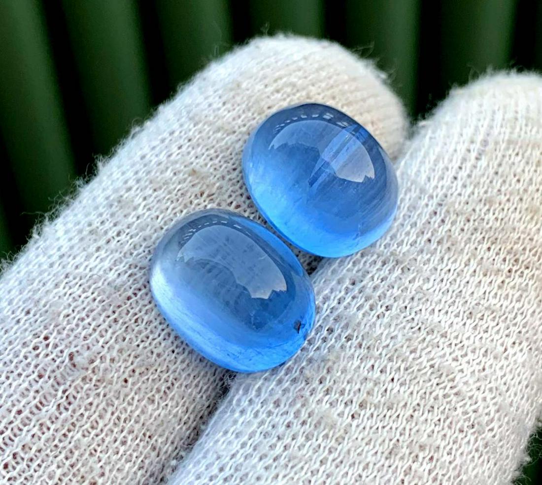 Cat: Materials: Gem type: Aquamarine Carat weight: 16 Description Cat's Eye Aquamarine Cabochon Gemstones Pair Deep Blue Color Weight - 16 Carats Dimensions - 13*11*8 mm - 13.3*11*8 mm DHL E Commerce SHIPP
