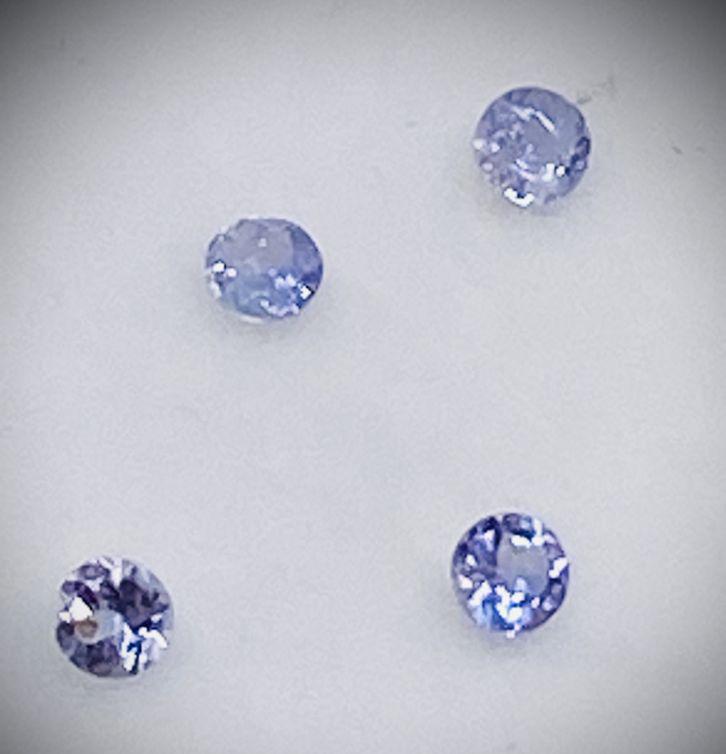 4 Adamantine TANZANITE AAA VVS / SI: Title: 4 Adamantine TANZANITE AAA VVS / SI Description: 4 x Adamantine TANZANITE - Shape: Round Faced - Weight: 0.23 tcw - Colour: Blue Violet - Clarity: VVS/ SI - Size: 2.4mm - Treatment: Heated - 10