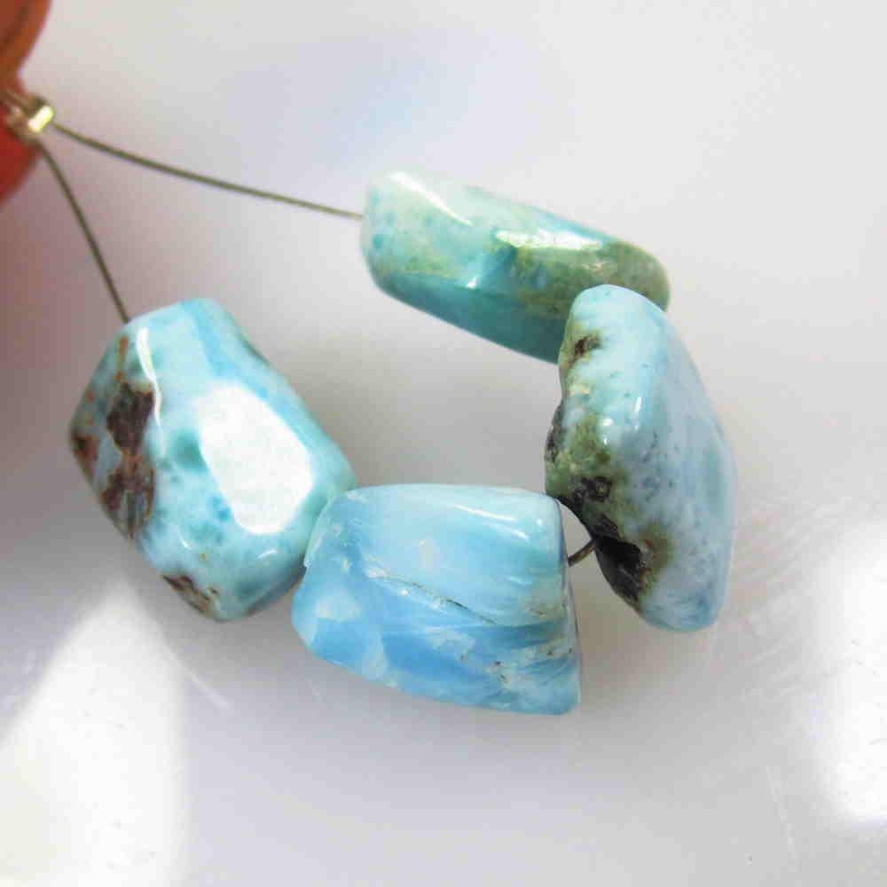 24.01 Ctw Natural 4 Drilled Amazonite Unshaped Beads: No Reserve! Title: 24.01 Ctw Natural 4 Drilled Amazonite Unshaped Beads Stone Clarity: Transparent Gemstone:Amazonite Beads Carat Weight: 24.01 Size/Dimensions: 10.5x10.2 to 12.5x8.9 mm / 4 PC's Addit