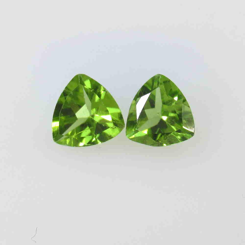 2.09 Ctw Natural Pakistan Peridot Trillion Pair: No Reserve! Title: 2.09 Ctw Natural Pakistan Peridot Trillion Pair Stone Clarity: VVS Gemstone:Peridot Carat Weight: 2.09 Size/Dimensions: 7.00 x 7.00 x 3.50 mm / 2 PC's Additional Information: Top Cl