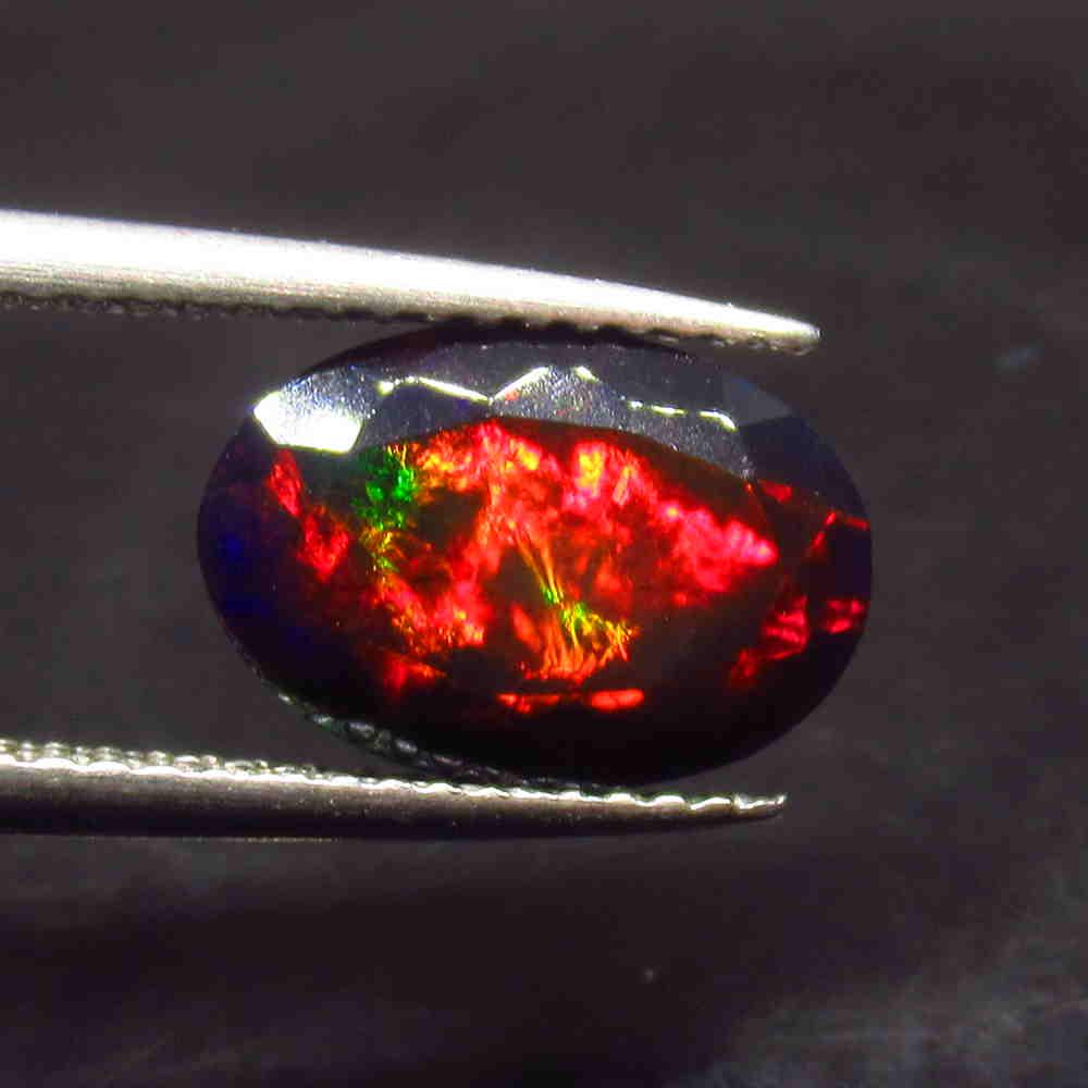 1.86 Ctw Natural Ethiopian Black Fire Opal Oval Cut: No Reserve! Title: 1.86 Ctw Natural Ethiopian Black Fire Opal Oval Cut Stone Clarity: Translucent Gemstone:Black Opal Carat Weight: 1.86 Size/Dimensions: 11.40 x 7.80 x 4.50 mm Additional Information: