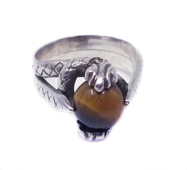 Silver 925 Serpent Tiger Eye Snake Ring: Silver 925 Serpent Tiger Eye Snake Ring Size 7. We offer this unique mystical serpent ring holding a round brown tiger eye in it's mouth. Intricate details depict the serpent wrapping the finger i a c
