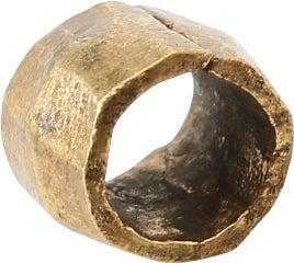 VIKING GILT BEAD, 9TH-11TH CENTURY AD: 6.2mm length, about ¼”. Hand formed from bronze, forged to hexagonal section with the center swelled to a ridge. Butted seam. Professionally refurbished with the 24karat gold overlay restor