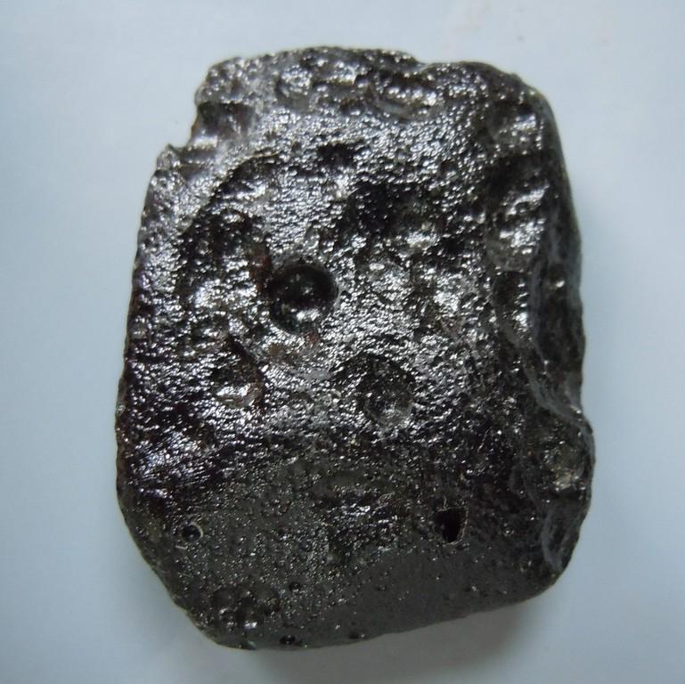 PHILIPPINITE TEKTITE - FROM METEORITE IMPACT: Title: PHILIPPINITE TEKTITE - FROM METEORITE IMPACT Origin: Paracale, Camarines Norte, Luzon, Philippines Size: 3x2.5x1 cm / 13 gram Additional Information: rectangular rizalite/philippinite tektite.