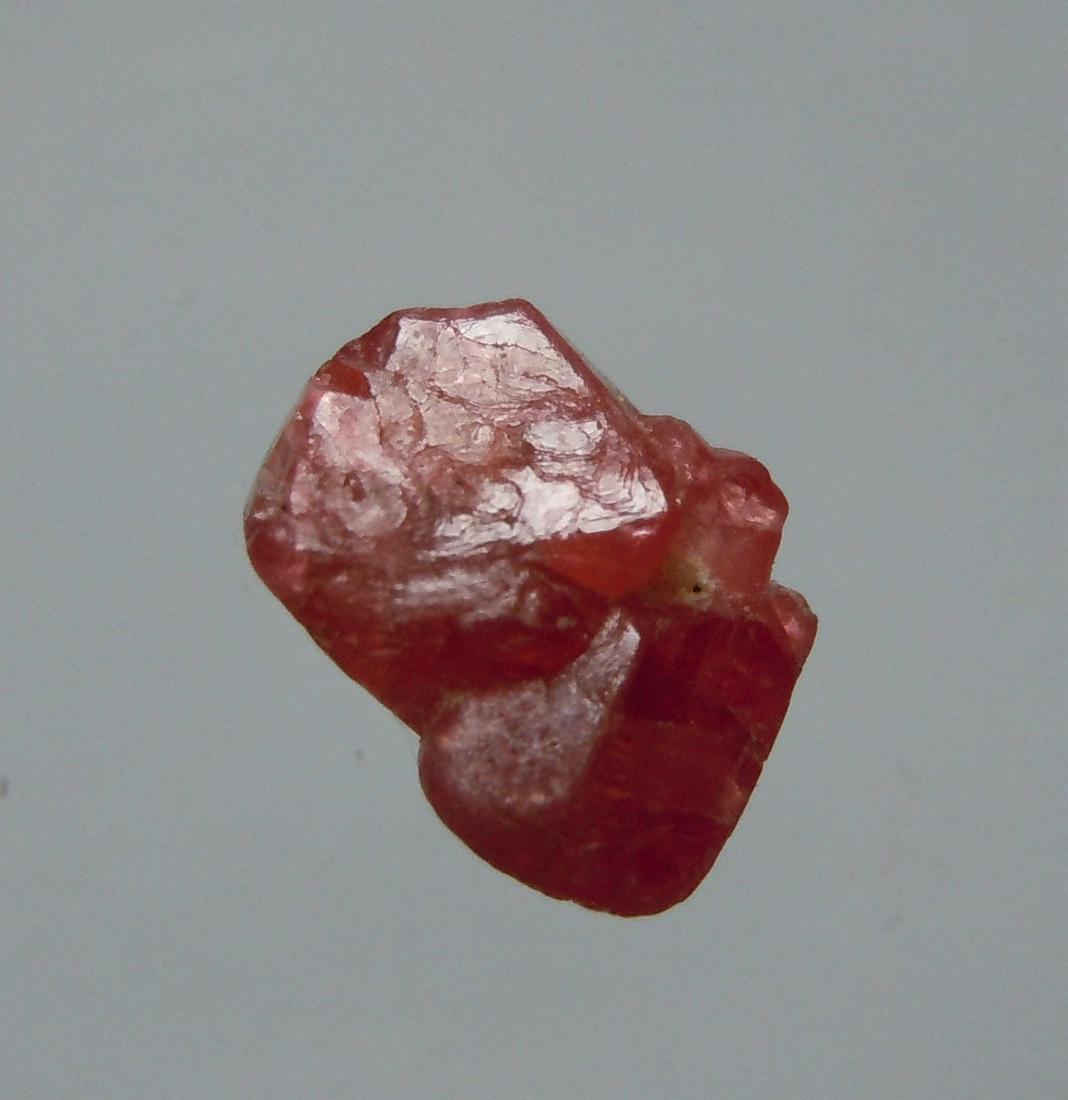2.05 CT TWINNED PYRAMIDAL RUBY - UNTREATED GEMSTONE: Title: 2.05 CT TWINNED PYRAMIDAL RUBY - UNTREATED GEMSTONE Origin: Mogok Township, Mandalay Reg. Myanmar Size: 0.8x0.61x0.52 / 0.41 gram Additional Information: twinned pyramidal vivid red and natural