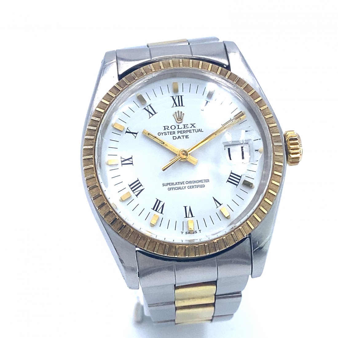 Rolex Oyster Perpetual Date Two Tone Watch: Rolex Oyster Perpetual Date Ref. 1505 wristwatch featuring a 14k yellow Gold bezel & white dial. Automatic movement. Stainless Steel & 14k Yellow Gold Oyster Band. Plastic crystal. Case diameter 34mm.
