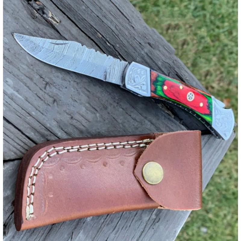Wild life damascus steel knife survival multi color: Knife "Machias" made of damask steel. Handle Â– multi color wood and scabbard - genuine leather. Damascus knives are very durable, look great and keep sharpness perfectly. Damascus steel has high q