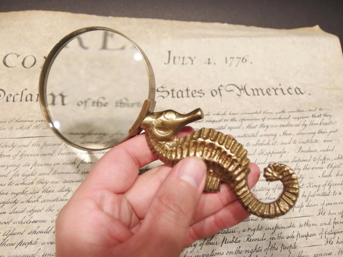 Brass Seahorse Magnifying Glass Desk Hand Lens: Vintage Antique Style Brass Seahorse Magnifying Glass Desk Hand Lens Description 7" Long x 3" Wide glass Nice reproduction of an antique Magnifying glass with a cast brass sseahorse handle. Magnifying