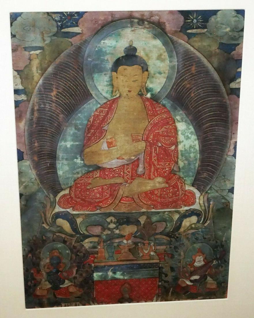 Tibetan Framed Buddhist Thangka Painting Fragment: Up for sale from a local estate in Honolulu Hawaii this 19th century or earlier Tibetan framed and matted Buddhist Thangka painting fragment depicting a seated Buddha. The condition is described above