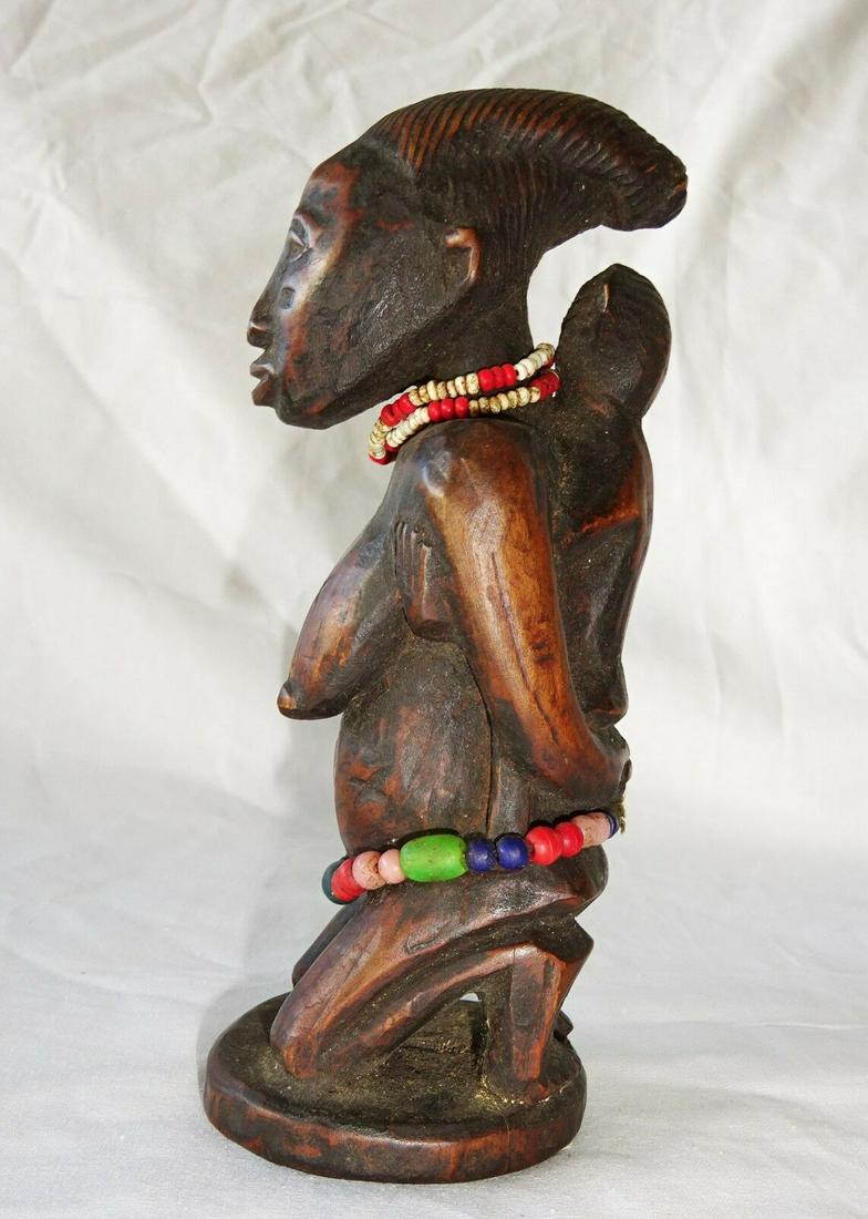 Zaire Wakuso Tribal Mother & Child Sculpture Carving: Up for sale from a recent collector in Honolulu this mid 20th century field collected African Zaire Wakuso Tribal carved Mother and Child sculpture or figure with old trade bead accents. For more deta