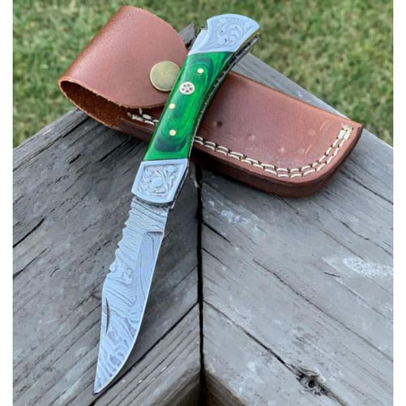 Folding damascus steel knife inner lock green wood: Knife "Portland" made of damask steel. Handle – resin, brass and scabbard - genuine leather. Damascus knives are very durable, look great and keep sharpness perfectly. Damascus steel has high qualit