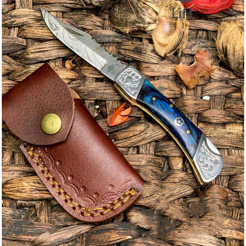 Folding damascus steel knife inner lock blue wood: Knife "Rockland" made of damask steel. Handle – blue wood and scabbard - genuine leather. Damascus knives are very durable, look great and keep sharpness perfectly. Damascus steel has high quality c