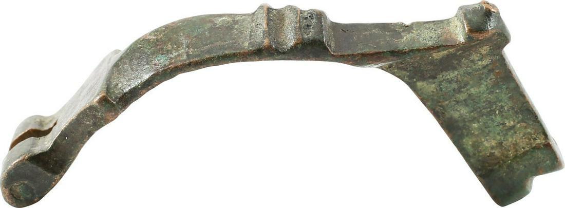 ROMAN BROOCH OR GARMENT PIN C.300-200 BC: No Reserve! Bronze, 1 5/8" length with a high arched frame with back crest and knob terminal. Known as fibula, these operate like large safety pins to secure garments, primarily at the shoulder. Good 