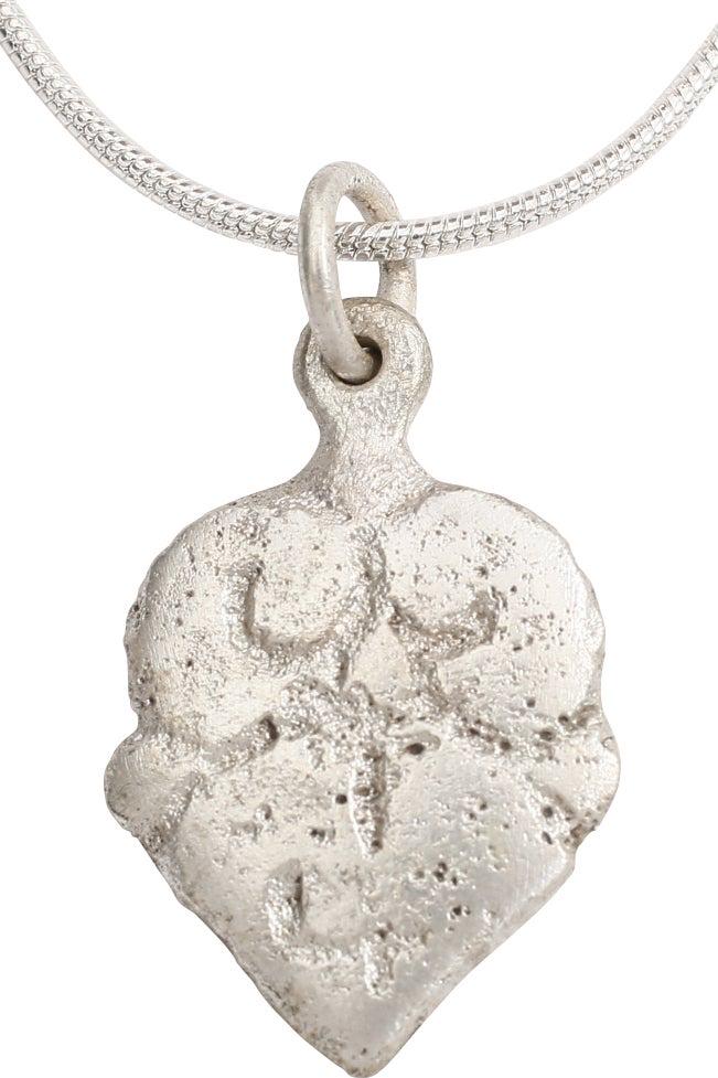 VIKING HEART NECKLACE C.850-950 AD JEWELRY: Just over 7/8" height including the loop. Made by the open face mold method. Heart form with nubbed medial and of the rounded section with the cusp formed by the foliate design. Both forms, cusped and