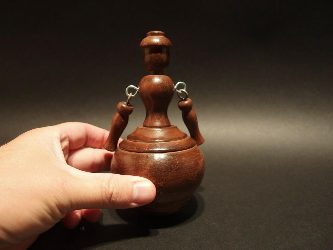 Turned wood doll Spinning Top Toy w Cloth Bag: 4" Tall Such a neat reproduction antique turned wood spinning top. Tops such as this are among the simplest of old toys. The earliest tops like this were many times made by children for fun out of scr