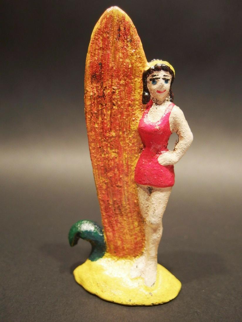 Cast Iron female Surfer Beach Beer Bottle Opener: 4 1/2" Tall Well made reproduction antique cast iron female surfer bottle opener. Nice detailed casting.. good heavy solid piece.. Reserve: $12.00 Shipping: Domestic: Flat-rate of $6.00 to anywhere wi