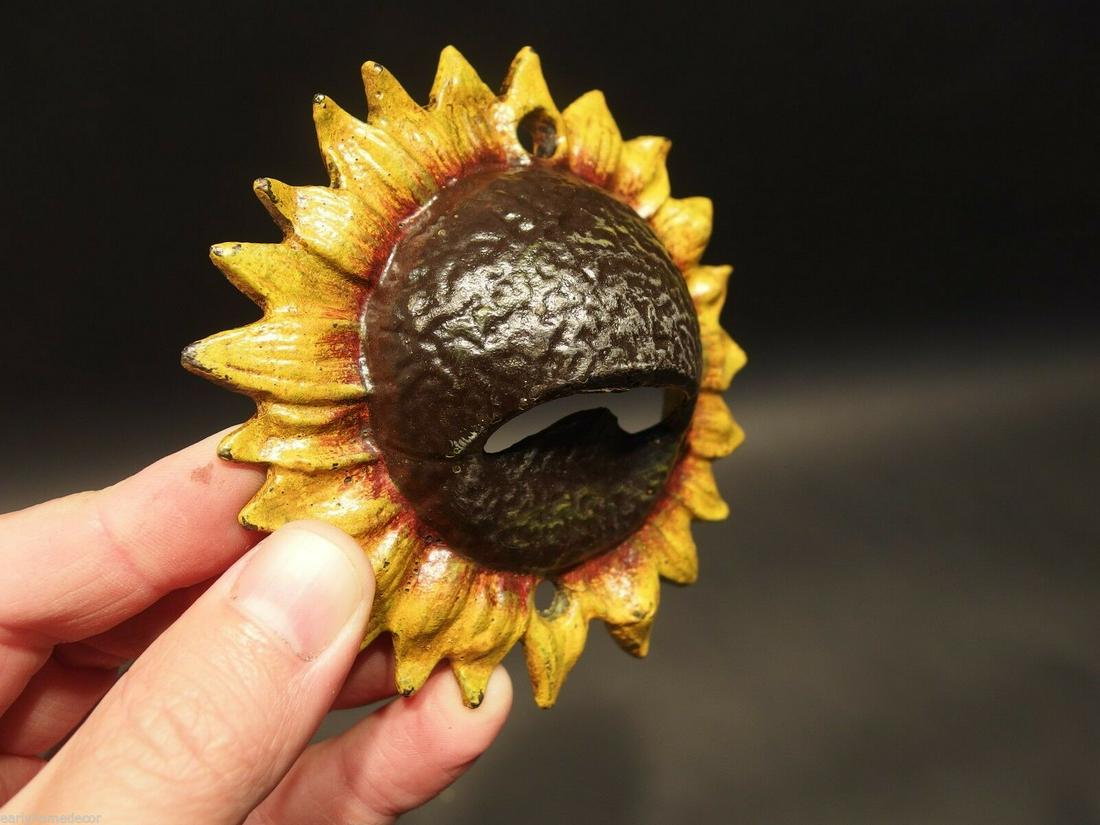 Cast Iron Folk Art Beer Soda Bottle Cap Sunflower: 4" round Great folk art cast iron bottle opener. This piece was hand painted and aged to look like an antique. Reserve: $10.00 Shipping: Domestic: Flat-rate of $7.00 to anywhere within the contiguous 