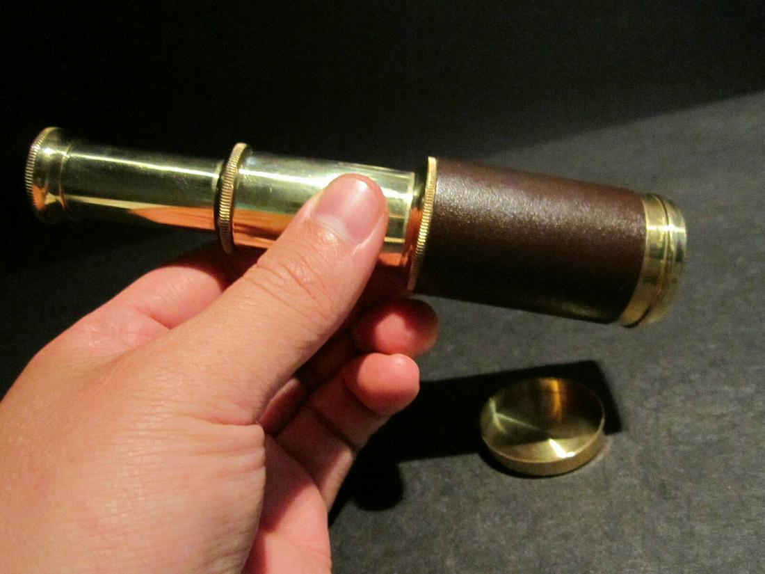Brass & Leather Traveling Pocket Telescope: Vintage Antique Style Solid Brass & Leather Traveling Pocket Telescope Description Telescope measures 3 3/8" Long closed x 6 1/4" open Nice quality reproduction of a traveling pocket telescope and cap