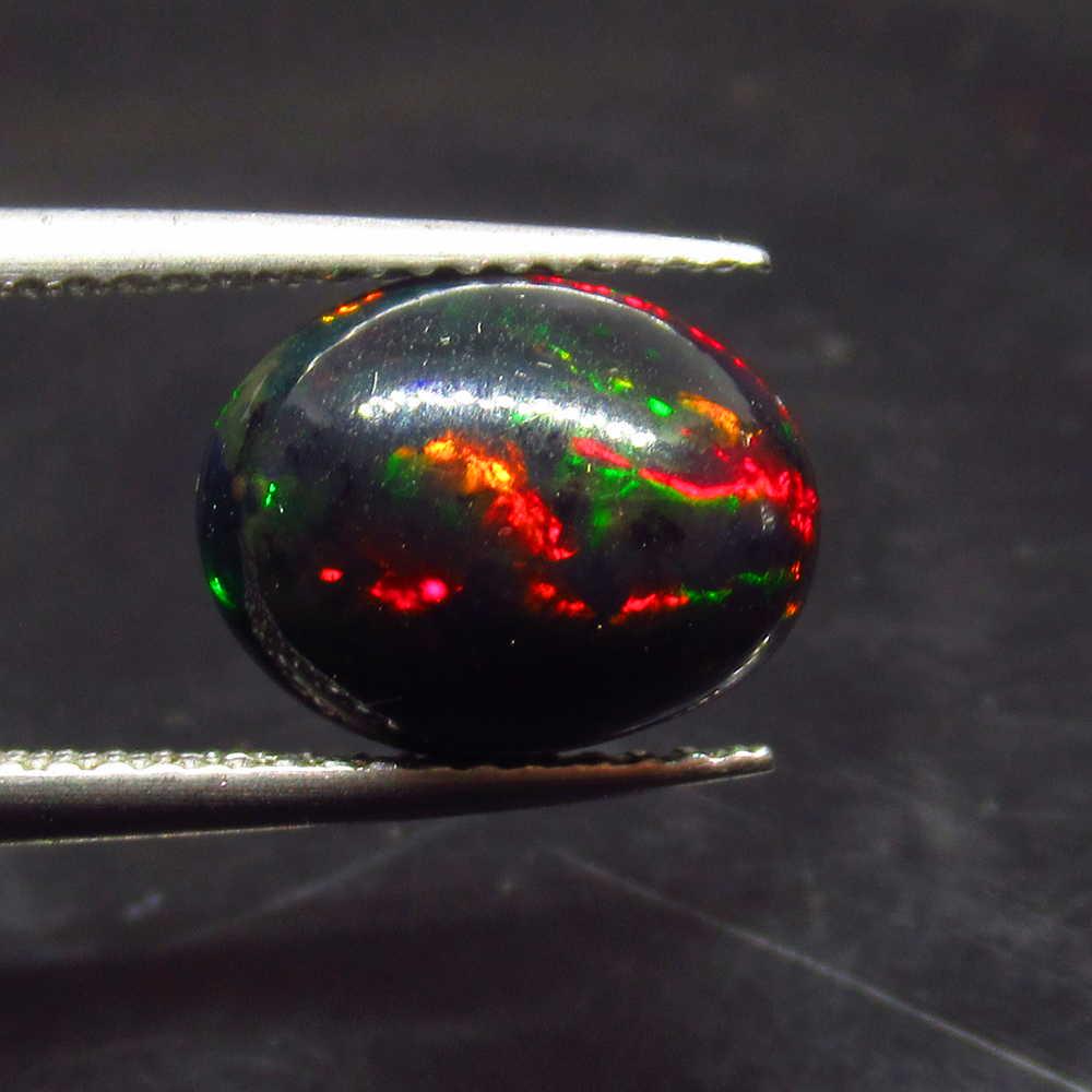 2.63 Ctw Natural Ethiopian Black Fire Opal Oval Cab: No Reserve! Title: 2.63 Ctw Natural Ethiopian Black Fire Opal Oval Cab Stone Clarity: Translucent Gemstones: Black Opal Size/Dimensions: 2.63 Carat Weights: 11.10 x 8.70 x 6.20 mm Additional Informati