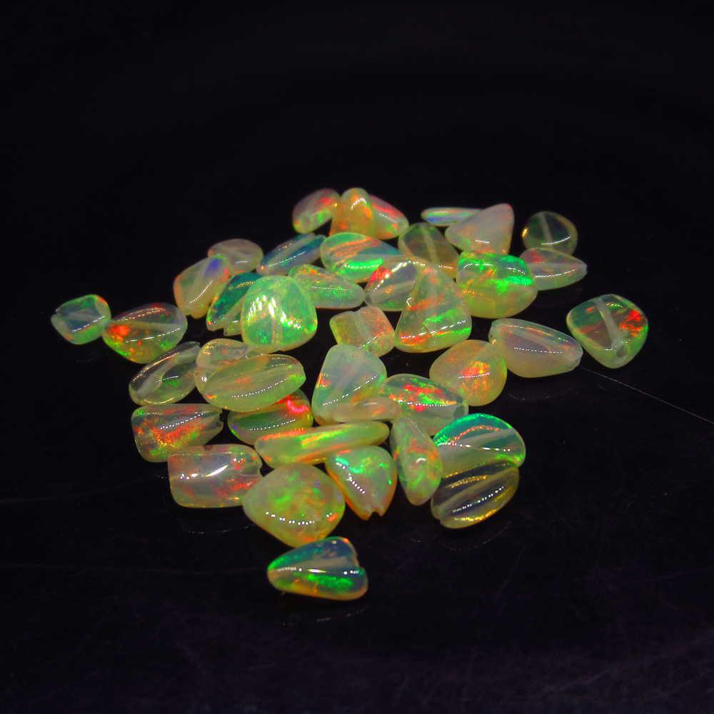 9.08 Ctw Natural 41 Drilled Fire Opal Beads: No Reserve! Title: 9.08 Ctw Natural 41 Drilled Fire Opal Beads Stone Clarity: Transparent Gemstones: Fire Opal Beads Size/Dimensions: 9.08 Carat Weights: 4.7x4.0 - 7.3x4.8 mm / 41 PC's Additional Info