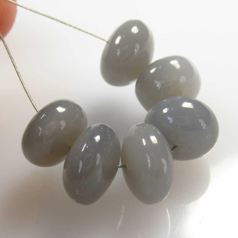 27.64Ct Natural 6 Drilled Moonstone Round Beads: No Reserve! Title: 27.64Ct Natural 6 Drilled Moonstone Round Beads Stone Clarity: Opaque Gemstones: Moonstone Beads Size/Dimensions: 27.64 Carat Weights: 10.00 to 11.00 mm / 6 PC's Additional Informat