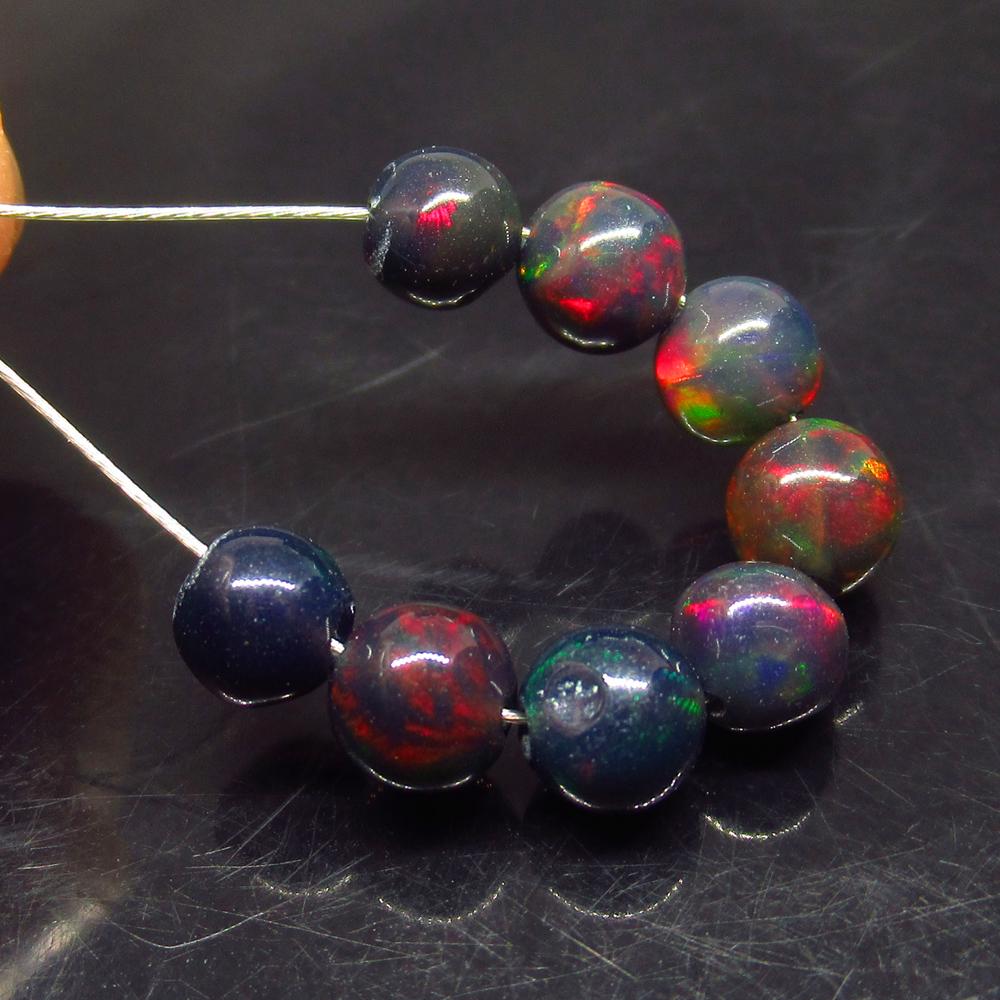 3.93 Ct Natural 8 Drilled Black Fire Opal Ball Beads: No Reserve! Title: 3.93 Ct Natural 8 Drilled Black Fire Opal Ball Beads Stone Clarity: Translucent Gemstones: Natural Black Opal Beads Carat Weights: 3.93 Size/Dimensions: 5.00 to 5.30 mm / 8 PC's Add