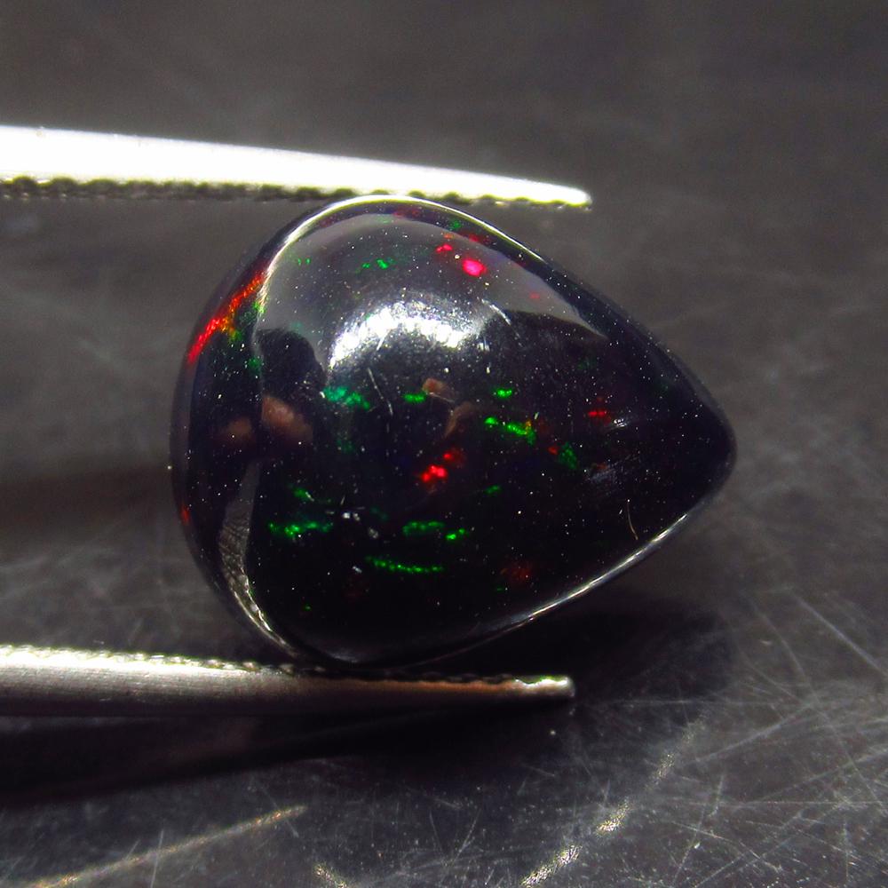 4.65 Ct Natural Ethiopian Black Fire Opal Pear Cab: No Reserve! Title: 4.65 Ct Natural Ethiopian Black Fire Opal Pear Cab Stone Clarity: Translucent Gemstones: Natural Black Opal Carat Weights: 4.65 Size/Dimensions: 13.20 x 11.10 x 7.50 mm Additional I