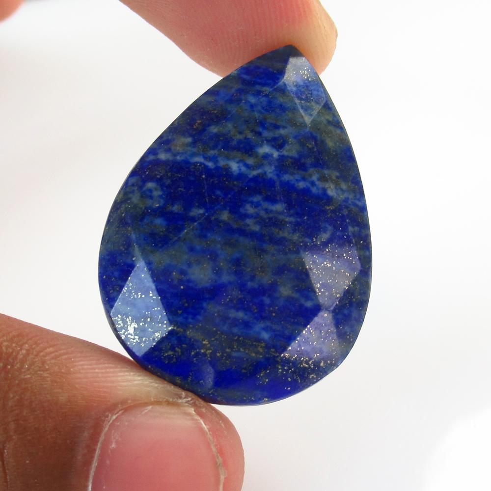 52.34 Ct Natural Drilled Blue Lapis Lazuli Pear Cut: No Reserve! Title: 52.34 Ct Natural Drilled Blue Lapis Lazuli Pear Cut Stone Clarity: Opaque Gemstones: Natural Lapis Lazuli Carat Weights: 52.34 Size/Dimensions: 35.00 x 25.00 x 8.30 mm Additional In