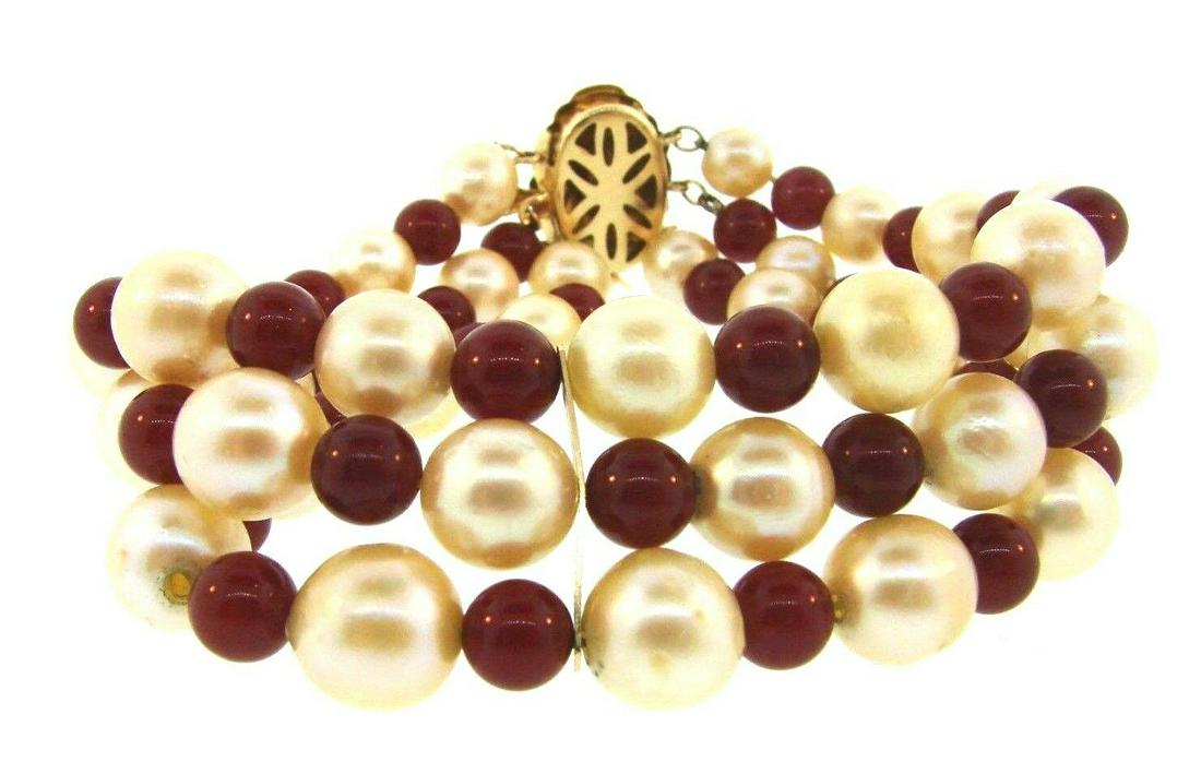 CLASSIC 14k Yellow Gold, Carnelian & Pearl Bracelet: DK 14k Yellow Gold, Pearl & Carnelian Bracelet Circa 1950s · Wonderful bracelet that is a necessity in your collection. · The weight in total is 50.4 grams. · The length is 8 3/8 inches. The thickn