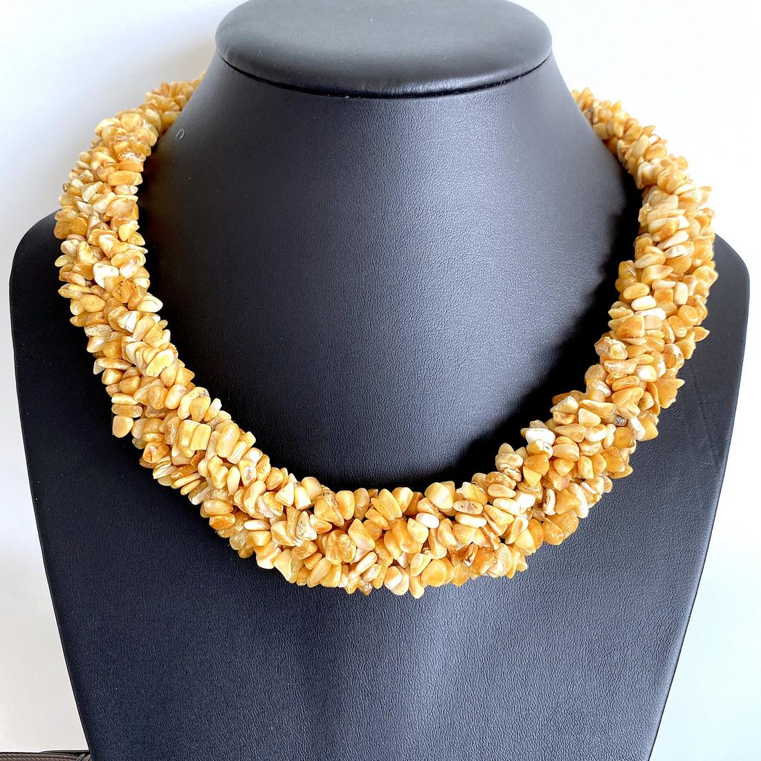 Phenomenal Amber Floral Necklace made from leaf like: Title: Phenomenal Amber Floral Necklace made from leaf like bead ornaments Metal: None Gemstones: Amber Weight: 64.3 g Size: Size: 550.0 x 25.0 x 10.0 mm Size: 21.654 x 0.984 x 0.394 inches Made of: W